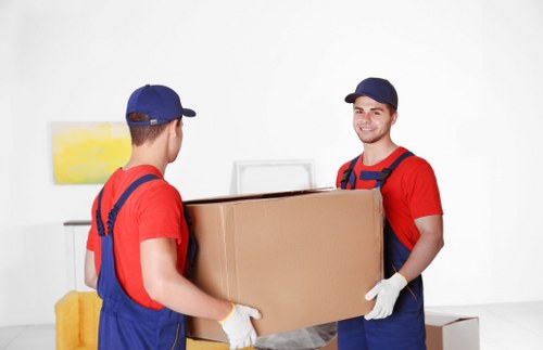 Professional movers loading furniture for a house removal in Uxbridge