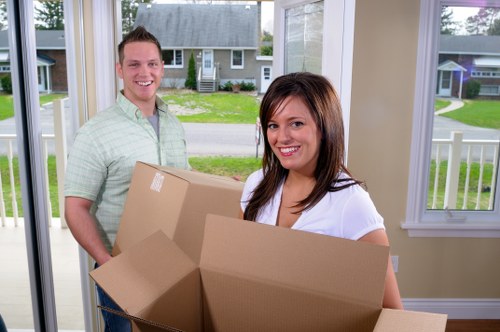 Office removals preparation with boxes and desks ready for transport