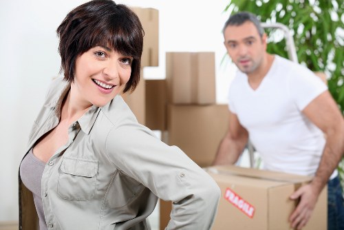 Office desks, files, and equipment prepared for relocation